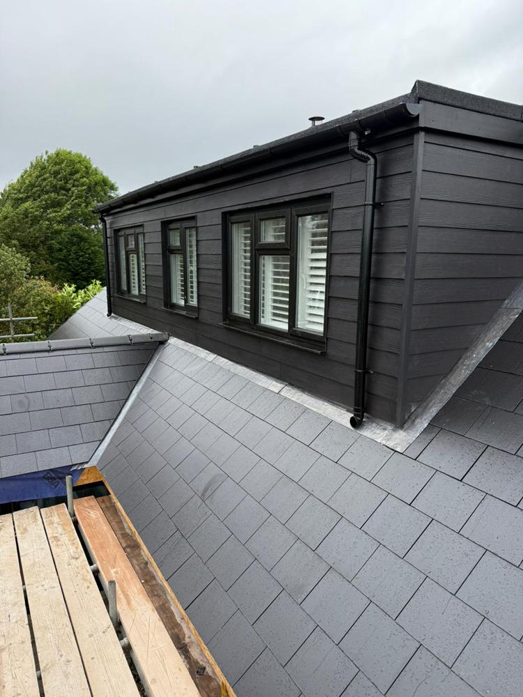 Close-up view from scaffolding of a slat roof, newly finished