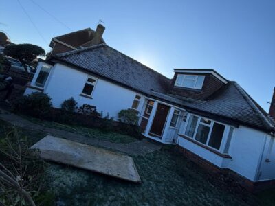 View of a bungalow with dormer window on private beach estate