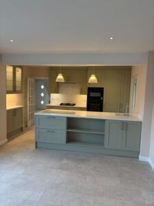 Newly fitted kitchen / dining room with grey units and wooden floor