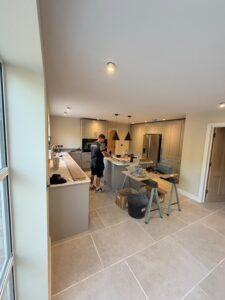 A tradesman working on a kitchen