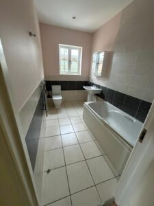 Bathroom with bath, toilet and basin.