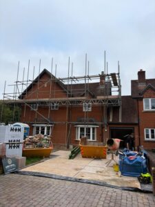 Front view of house with scaffolding from ground to roof height